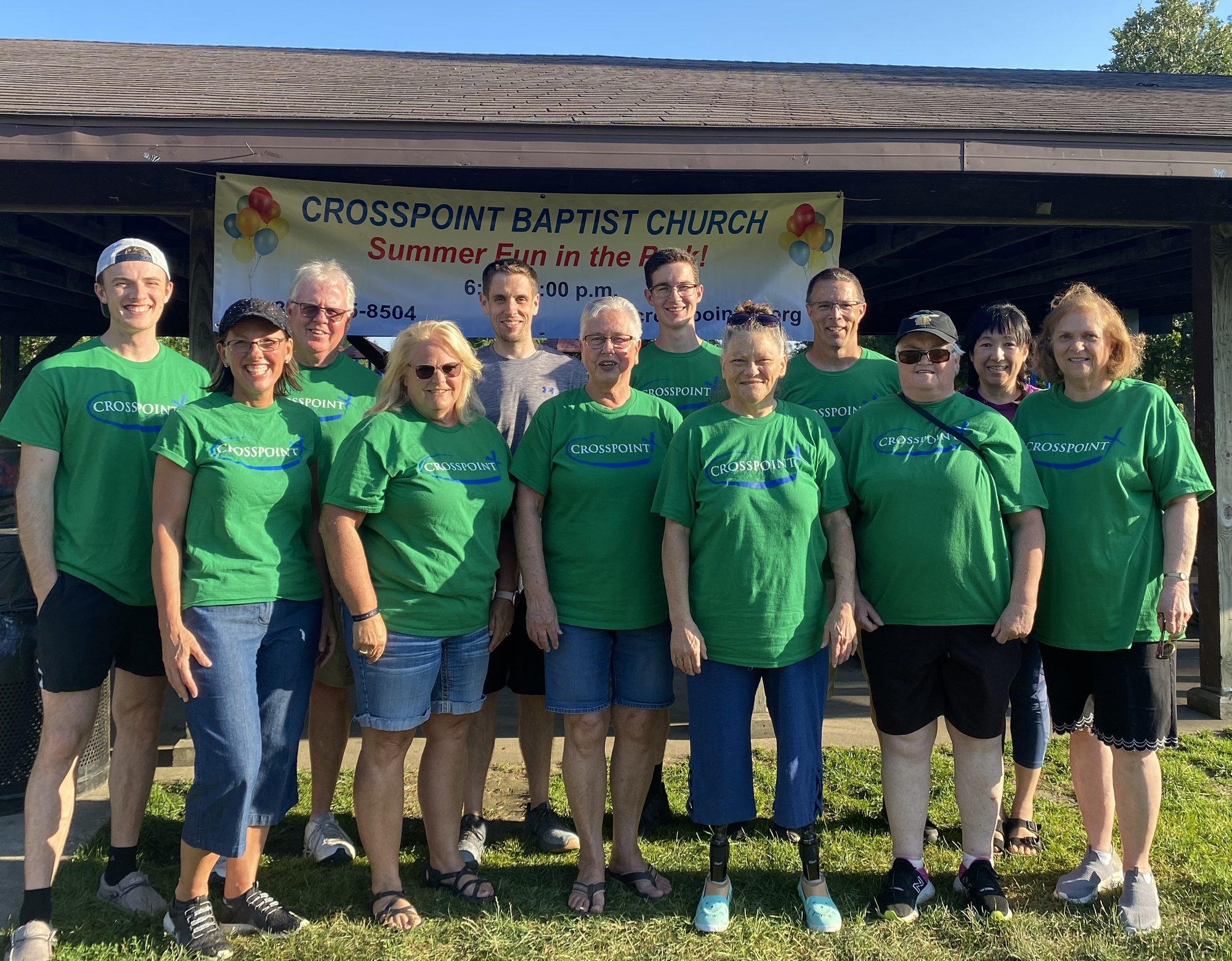 The Crosspoint Baptist Church outreach team in matching green shirts at Summer Fun in the Park