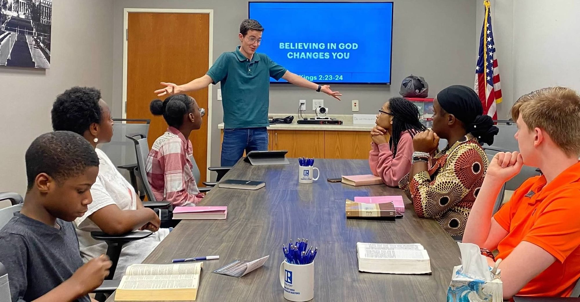 A teen leader teaching from the Bible at Crosspoint Baptist Church youth group